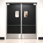 Heavy duty HPL traffic door suitable for food service environments, shown in an industrial or commercial kitchen setting.