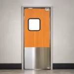 A swinging door built for high-traffic use in a commercial kitchen environment.
