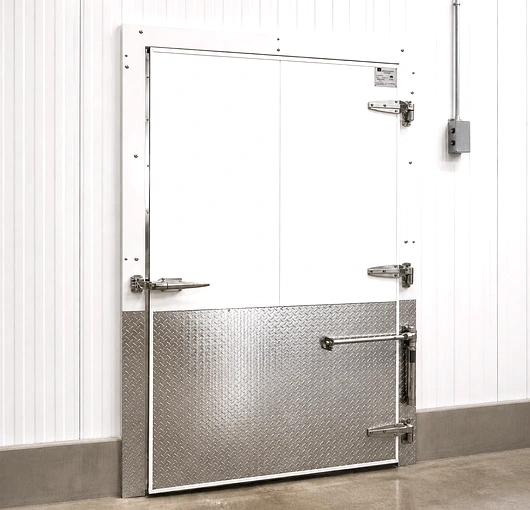 Heavy duty insulated swinging door for cold storage facilities, suitable for high-traffic commercial and industrial refrigerated environments.