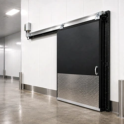 A PC 2000 temperature control swinging door installed at a cold storage facility entrance.