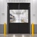 PE PVC swinging door installed in a pharmaceutical warehouse facility for controlled access and hygiene separation.