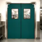 A PE 400 flexible PVC swinging door mounted in an industrial doorway, showing its clear panel construction.