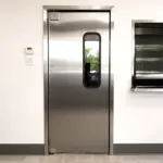 Stainless steel swinging door suitable for commercial kitchen pass-through or service entry applications.